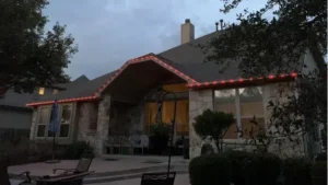 Custom permanent Christmas lighting setup by BlueHopper on a house exterior